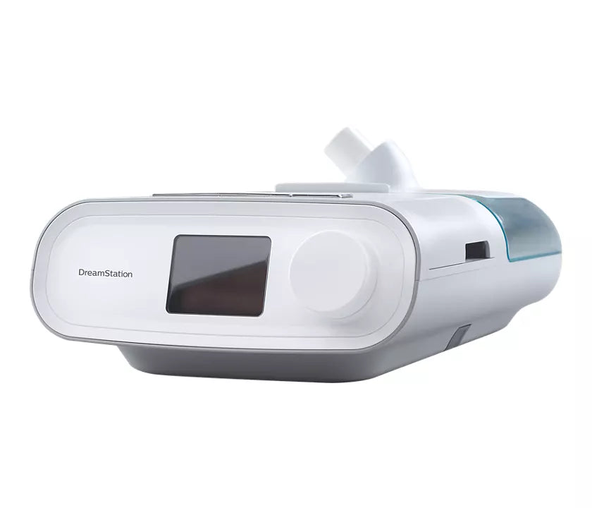 Side view of Philips Respironics DreamStation Auto CPAP with attached humidifier for humidification during therapy.