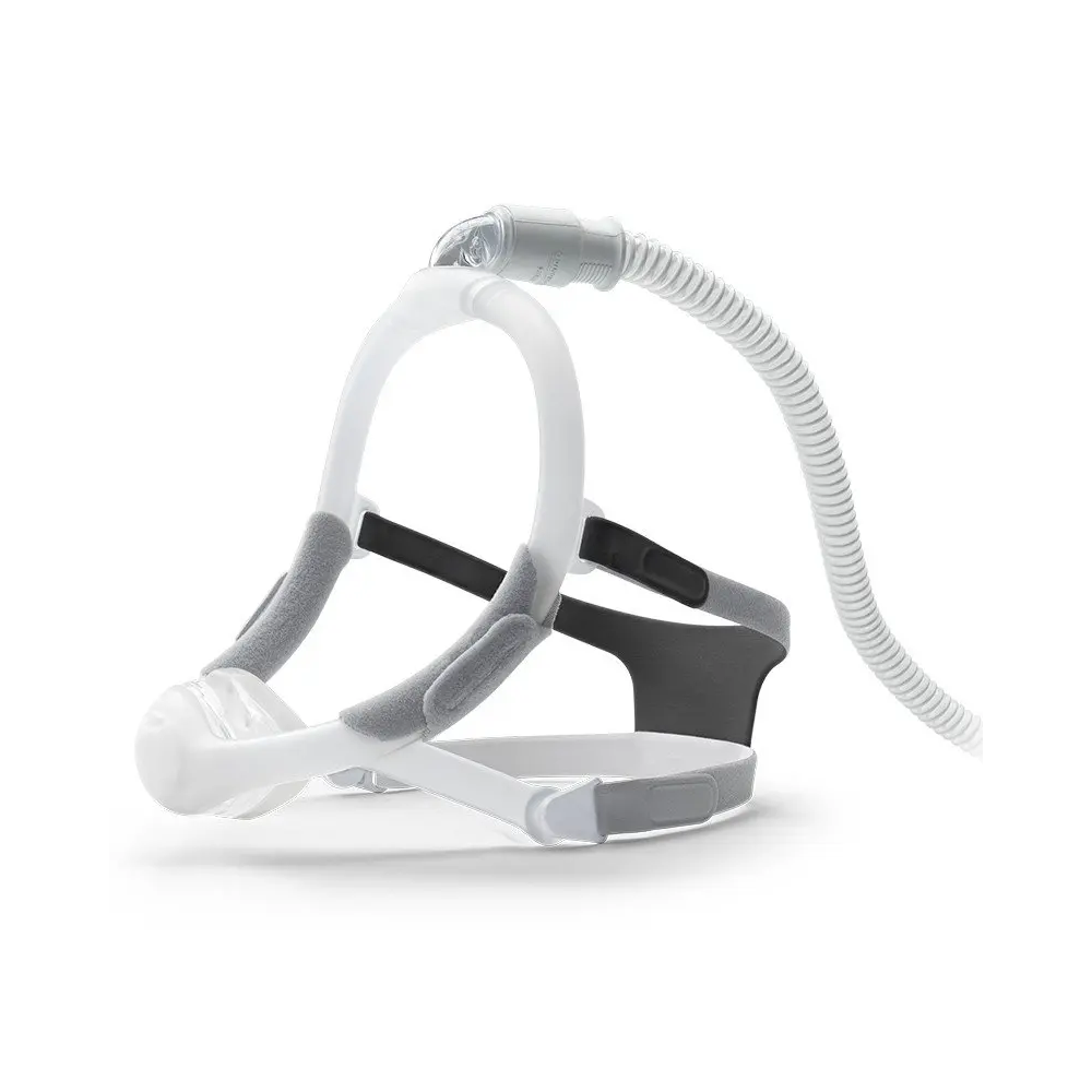 Philips Respironics DreamWisp CPAP Nasal mask with soft fabric chin sleeves, and connected to a CPAP tube