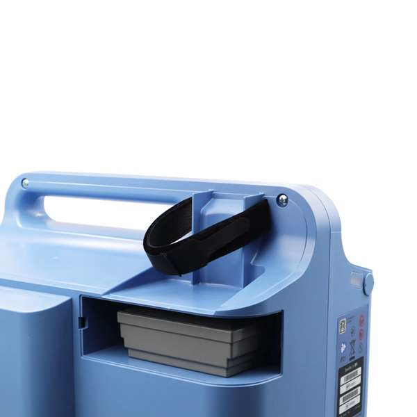 Opened the inlet filter compartment of the Philips Respironics EverFlo Oxygen Concentrator and the humidifier bottle holder.