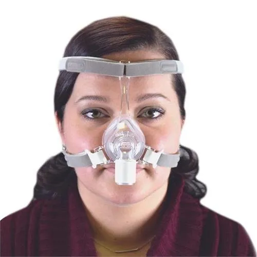 Front view of a woman wearing the Philips Respironics Pico nasal mask with headgear.